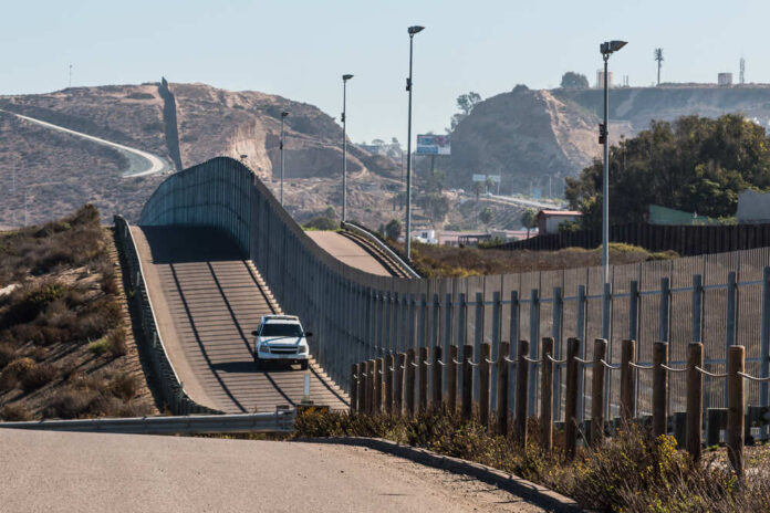 Border,Patrol,Vehicle,Patrolling,Along,The,Fence,Of,The,International