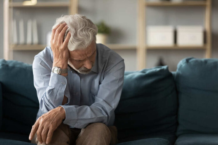 Frustrated,Unhappy,Middle,Aged,Mature,Man,Sitting,On,Sofa,,Feeling