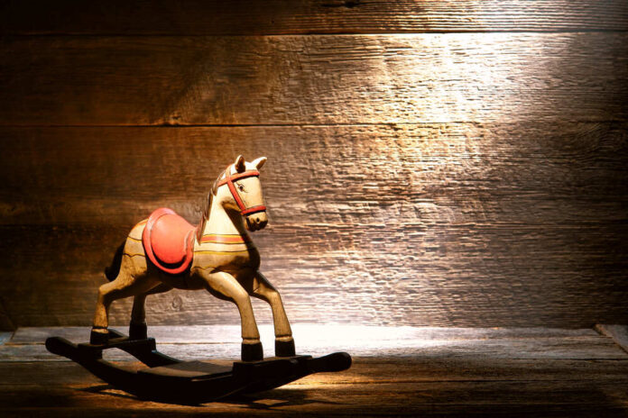 Nostalgic,Americana,Scene,Of,An,Antique,Reproduction,Wood,Toy,Rocking