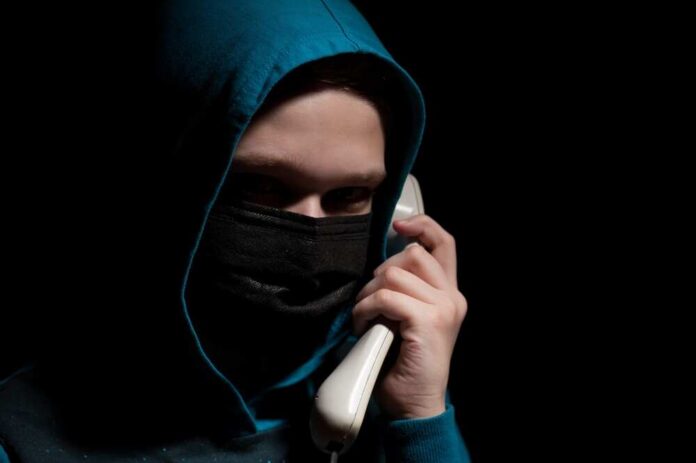 Unknown,Person,With,Covered,Face,Makes,An,Anonymous,Call,Intimidating