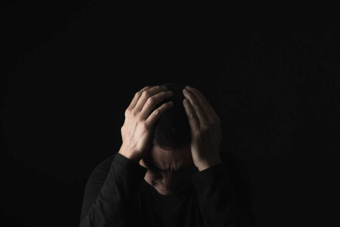 Closeup,Of,A,Desperate,Young,Caucasian,Man,With,His,Hands