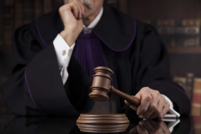 Courtroom,,Judge,,Male,Judge,In,Black,Mirror,Background