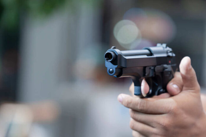 Man,Holding,Gun,Aiming,Pistol,In,Hand,Ready,To,Shoot.