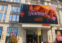 Movie poster for Disneys Snow White on building