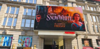 Movie poster for Disneys Snow White on building
