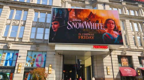 Movie poster for Disneys Snow White on building