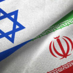 Israeli and Iranian flags overlapping.