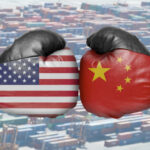 Boxing gloves with US and China flags clash