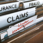 Defense Attorney Caught in $250K Swindle File folders labeled insurance, fraud, claims, investigation.