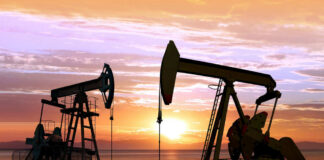 Oil pumps silhouetted against a sunset sky