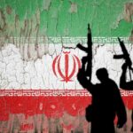 Silhouettes of armed figures in front of a distressed Iranian flag