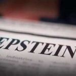 Close-up of a newspaper headline reading 'EPSTEIN'