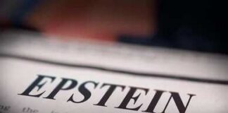 Close-up of a newspaper headline reading 'EPSTEIN'