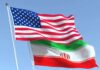 10,000 Troops to Iran: Real or Hype? American and Iranian flags waving in the sky.