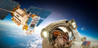 Astronaut and satellite orbiting Earth.