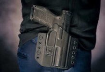 ATF’s Unseen Power: Brace Owners Beware! Person wearing gun in a holster on hip