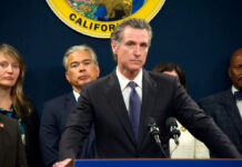 Person speaks at podium with California seal behind.