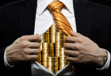 Heliboat Havens: The New Billionaire Status Symbol Businessman revealing gold coins under his shirt