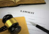 A gavel resting on legal documents related to a lawsuit