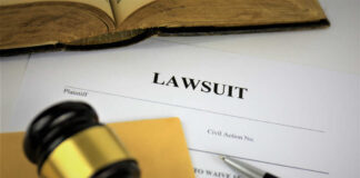 A gavel resting on legal documents related to a lawsuit