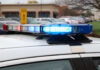 Close-up of a police car's emergency lights in a parking lot