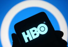 HBO’s Harry Potter Trailer Shatters Viewing Records HBO logo displayed on a smartphone against a blue background