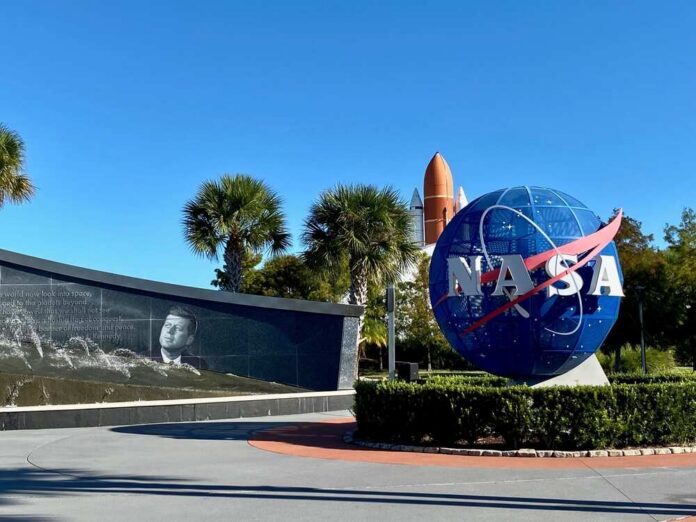 NASA logo and memorial wall featuring John F. Kennedy