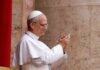 Pope clapping and smiling during a public appearance