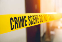 Cartel Ambush Near US Border Stuns Nation Yellow crime scene tape with the words 'CRIME SCENE DO NOT CROSS'