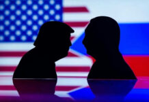 Putin’s Trap: Draining U.S. Power, Threatens NATO Two silhouettes facing each other with flags background