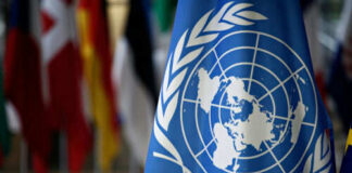 United Nations flag with world map emblem displayed