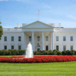 White House with fountain and flowers in front