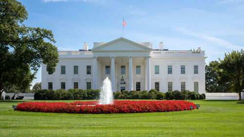 White House with fountain and flowers in front