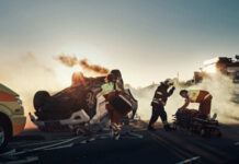 Emergency responders at an overturned, smoking car on a roadway