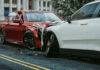 Two cars with severe front-end collision damage.