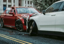 Two cars with severe front-end collision damage.