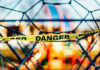 Danger tape on playground equipment structure.