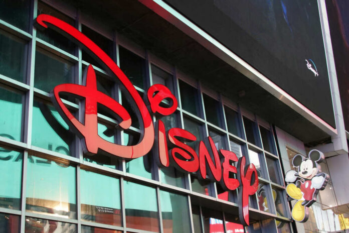 disney-store2212408911jpg Disney storefront with large red logo and Mickey Mouse figure