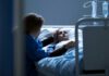 Shocking Betrayal: Boyfriend Hijacks Coma Victim’s Life Patient in hospital bed comforted by visitor