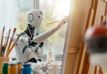 Robot painting on a canvas in art studio.