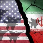 A cracked wall featuring the flags of the United States and Iran, with military aircraft silhouettes