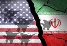 A cracked wall featuring the flags of the United States and Iran, with military aircraft silhouettes