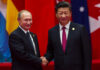 Two international leaders shaking hands at a diplomatic event
