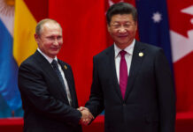 Russia-China Axis: UNPRECEDENTED Moves Unravel Two international leaders shaking hands at a diplomatic event