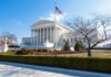 NFL’s Arbitration SHIELD Stripped By Court Decision United States Supreme Court building with flag and columns