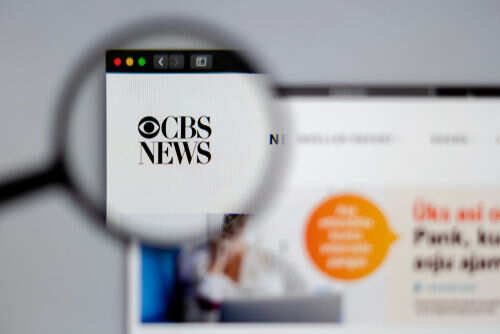 1351207052 CBS News website viewed through a magnifying glass.