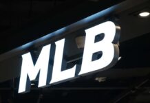 Florida AG Targets MLB Over Bible Hats Illuminated MLB sign on a dark ceiling