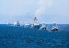 Ceasefire Chaos: Who Hit That Ship? A fleet of warships sailing in formation on the ocean