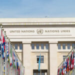 Geneva Deal Signed — Core Fight Remains United Nations building with rows of world flags