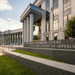 Black Budget Heist — 300 Gold Bars Found Colorado Supreme Court building with columns and signage